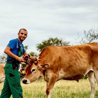 Madheshdas Ananda with a cow