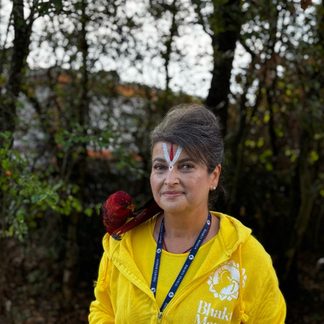 Shridevi with a red lory on her shoulder