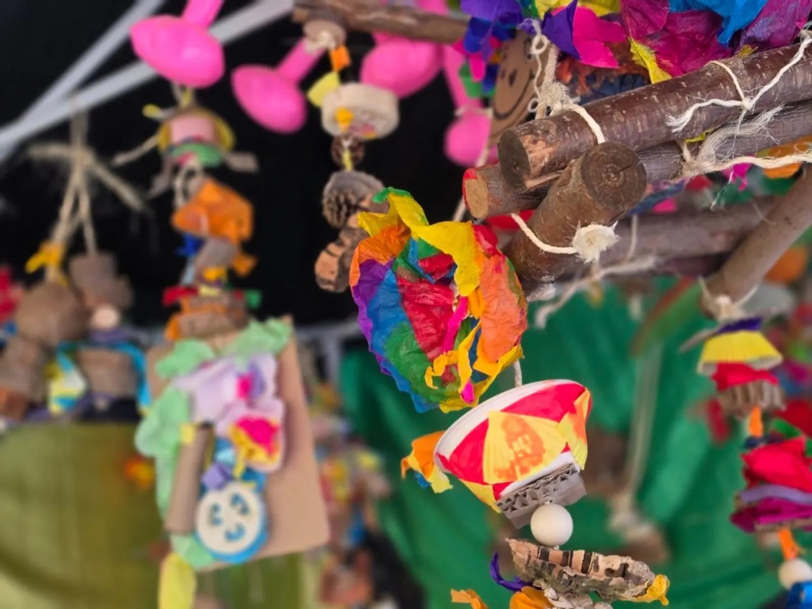 Colourful handmade recycled enrichment hanging together